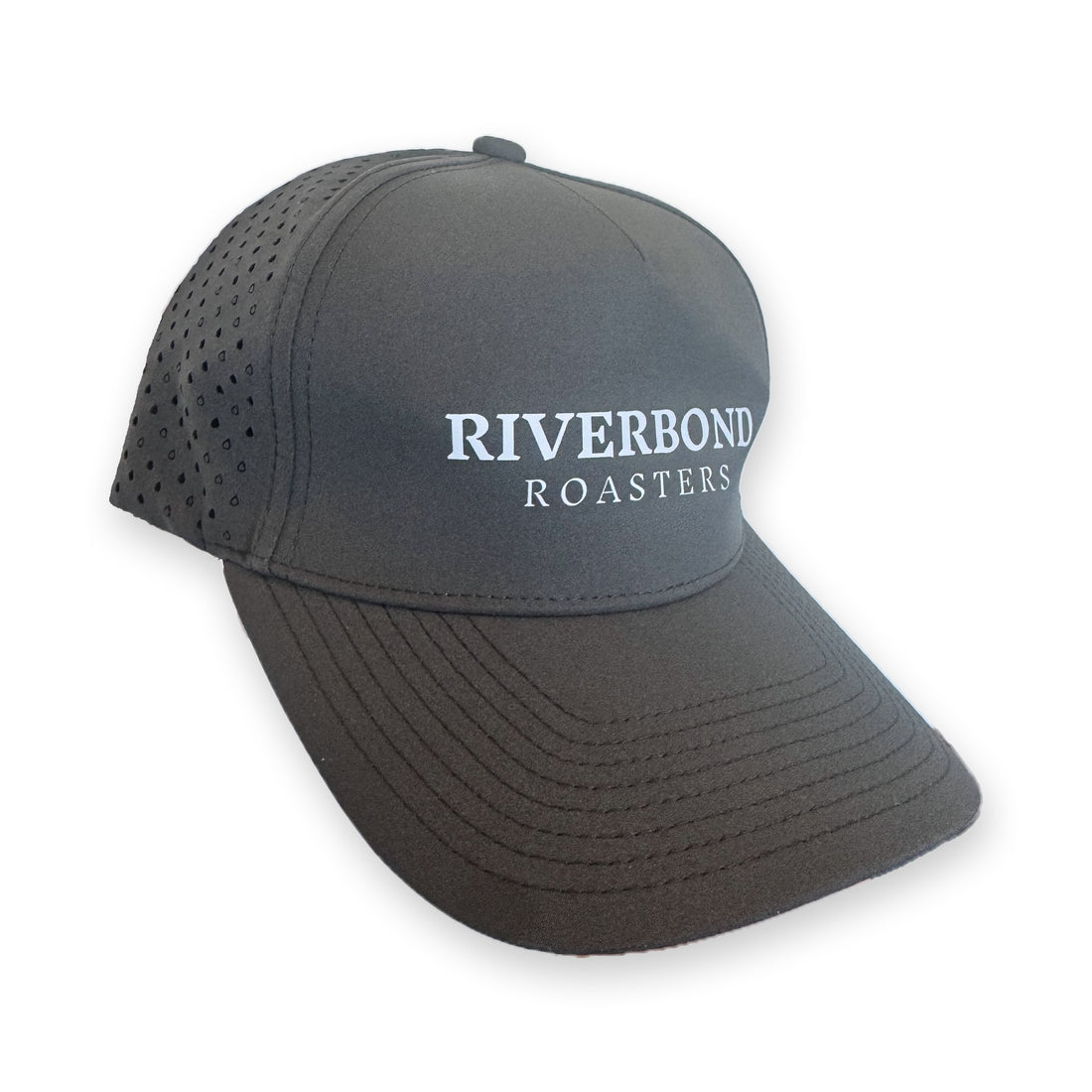 Riverbond Athletic Snapback with the white logo, from the side, showing the perforated panels